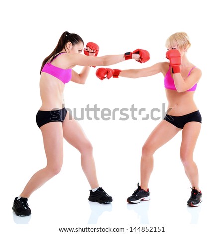 sport training of two boxing young woman, studio over white