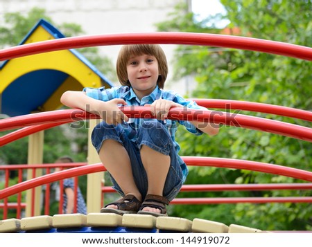 children playing on  playground in summer outdoor park