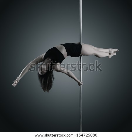 pole dancer, young woman dancing on pylon, toned and noise added