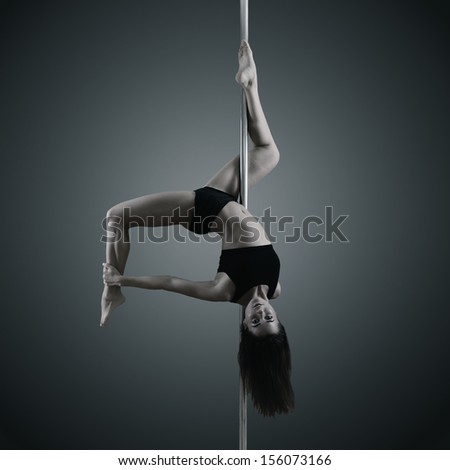 pole dancer, young woman dancing on pylon, toned and noise added