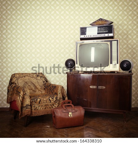 Vintage Room With Wallpaper, Old Fashioned Armchair, Retro Tv, Bag, Clocks, Radio Player And Loudspeakers. Toned