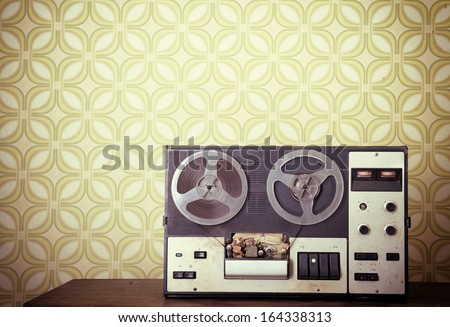 Retro portable reel to reel tube tape-recorder, toned, with copyspace. Toned