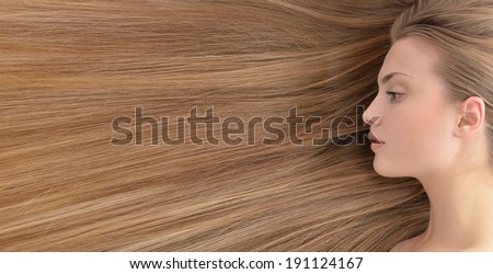 Fair hair. Beautiful young woman with  long healthy hair.