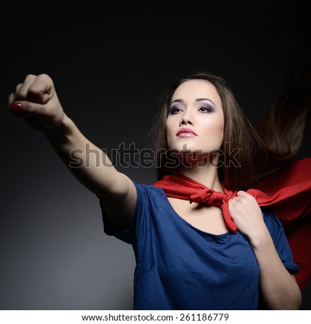 Superwoman. Young pretty woman opening her shirt like a superhero. Super girl, image toned. Beauty saves the world.