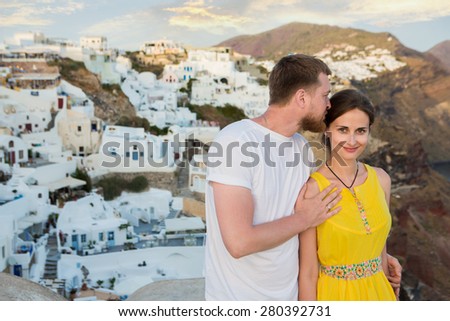 Newlyweds on the background of the romantic city of Greece. Santorini Island. Happy moments