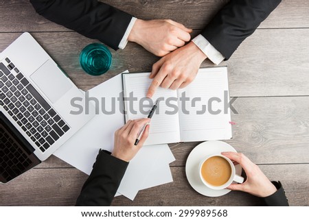 Businessman and Businesswoman joint coffee break. Top view. empty white space you can put your text