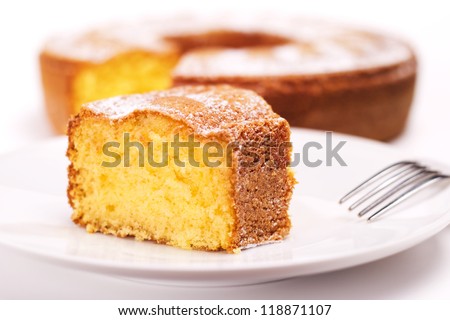 close up of piece of cake with icing sugar