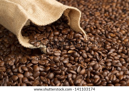 jute bag on background of coffee beans