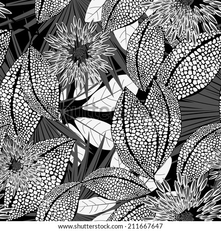 Tropical black and white spotted flowers in a seamless pattern .