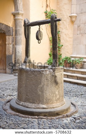 Vintage water well in a medieval village in Spain