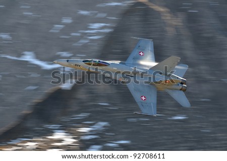 AXALP, SWITZERLAND - OCTOBER 12: Swiss Airforce F/A-18 Hornet during Axalp Swiss Air Force Live Firing Demo on October 12, 2010 in Axalp, Switzerland