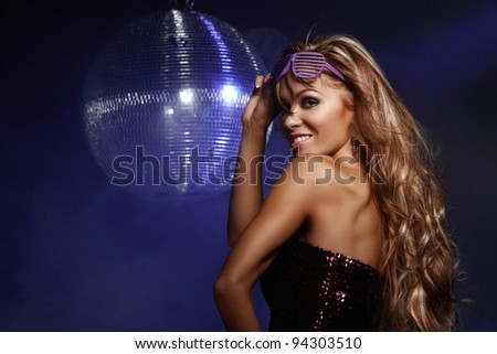 Portrait of dancing girl on disco party
