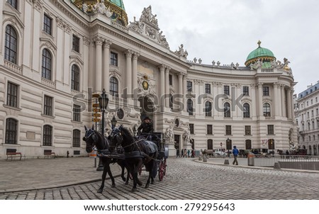VIENNA, AUSTRIA - JANUARY 11, 2015: Horses on Saint Michael square behind Hofburg palace in the center of Vienna, Austria, January 11, 2015