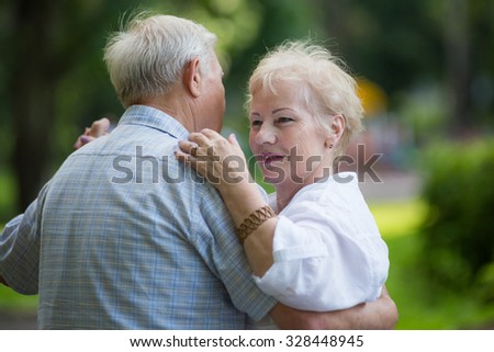 KOROLEV, MOSCOW REGION, RUSSIA - SUMMER, 2015: Smiling couple of old men and woman are dancing waltz at open-air event at the city of Korolev, Moscow region, Russia, Summer, 2015