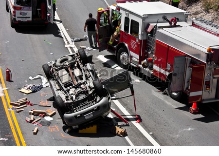 Monterey, California - June 29: The Scene Of A Traffic Accident On June 29, 2013, Involving An Overturned Sport Utility Vehicle.