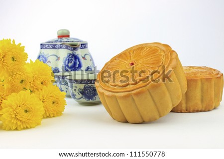 Moon cakes decorated with chrysanthemum on white background