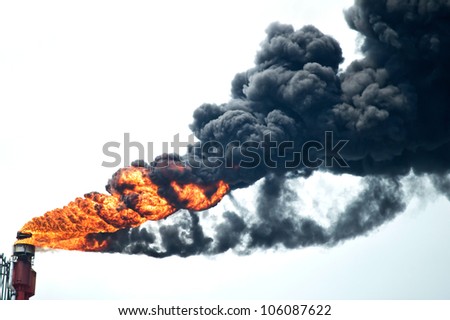 Heavy smoke from industrial chimney polluting the environment