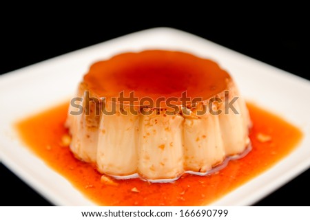 Caramel pudding on white plate