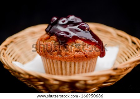 Blueberry cupcake on white background