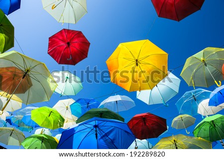 Lots of umbrellas coloring the sky in the city of Pai, Thailand