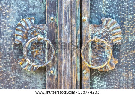 Old scratchy bronze door handles