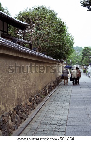 3 Japanese ladies walking down the street