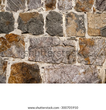 old stone wall using multi colored stones