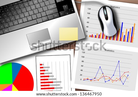 Desk with a laptop and a set of statistics to monitor the progress of the business