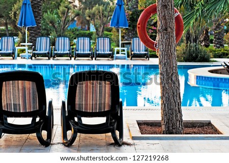 Chaise lounge by the pool to relax in the villa.