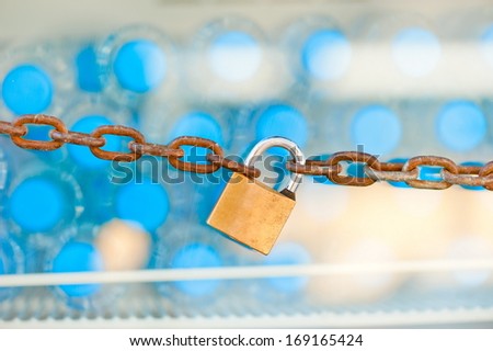 padlock and chain on the refrigerator with water