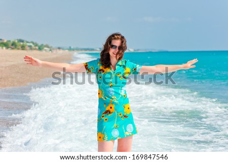 girl with arms wide open in the beautiful dress