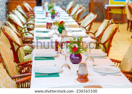 long beautifully set table in a restaurant