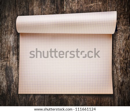 Opened blank notebook on old wood background