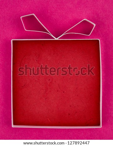Hand made empty gift box, textured paper as background. Free space for text. Greeting card