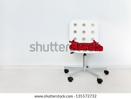 White chair against wall