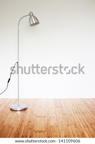 Empty room with modern floor lamp