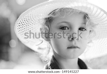 Blonde baby girl  outdoor. Closeup black and white vintage portrait
