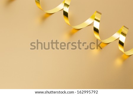 Golden ribbon on golden background