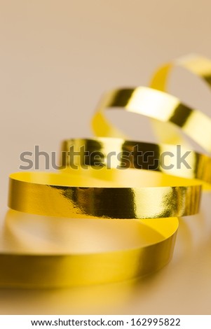 Golden ribbon on golden background