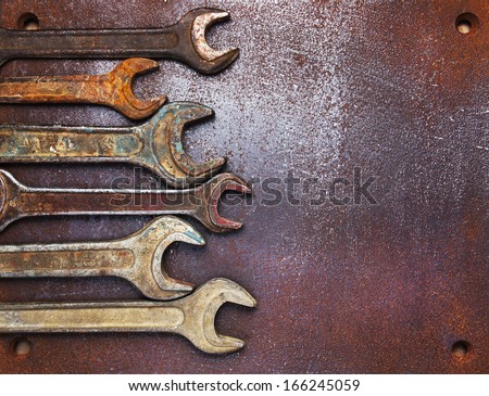 Old wrenches on a metal table