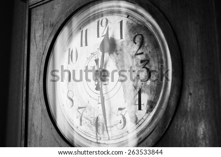Antique grandfather clock, black and white photo, close up photo