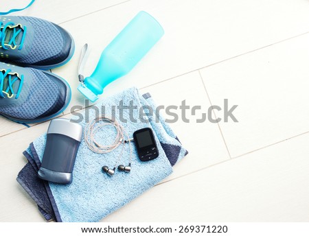 Pair of sport shoes and fitness accessories. Fitness concept