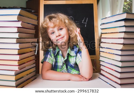 Portrait of cute schoolgirl raising hand knowing the answer to the question