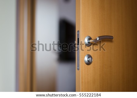 Hotel room or apartment doorway with open door