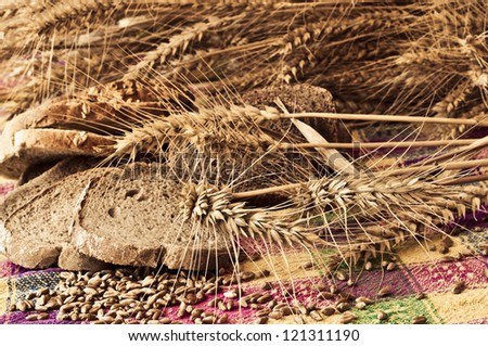 Sliced bread, wheat ears and wheat seeds