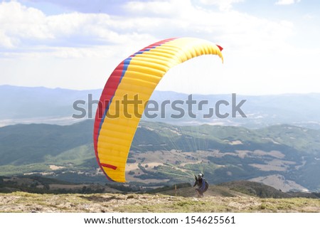 Paraglider take off. Paragliding as extreme and fun sport