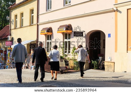 Wadowice, Poland - September 07, 2014: Tourists visit the city center of Wadowice. Wadowice is the place of birth of Pope John Paul II