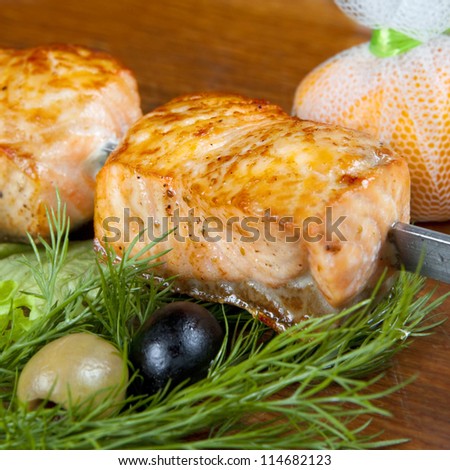 Shish kebab from a salmon with black and green olives and lemon-square