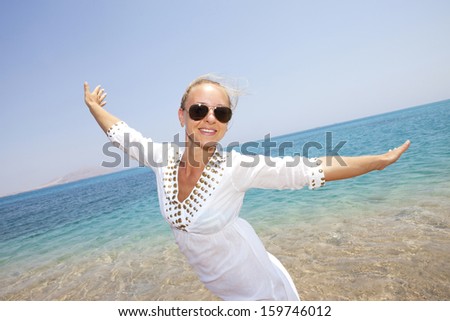 lifestyle concept - beautiful happy woman enjoying summer on the sea