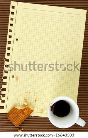 Biscuits, coffee, paper. At brown background.The model for posting your pictures or inscriptions.